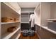 Spacious walk-in closet with custom shelving, ample storage, and a robe at 367 Josef Cir, Fort Lupton, CO 80621