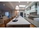 Open kitchen with eat-in island, gourmet appliances, and a view into the living room at 367 Josef Cir, Fort Lupton, CO 80621