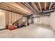 Unfinished basement featuring exposed beams, insulation and concrete floor at 8833 Meade St, Westminster, CO 80031