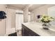 Bathroom featuring vanity, bathtub with shower, and a flower arrangement on the counter at 8833 Meade St, Westminster, CO 80031