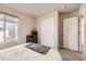 Bright bedroom with white closet doors, neutral walls, and window at 8833 Meade St, Westminster, CO 80031