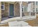 Close-up view of the front entrance, showcasing the door and stone facade at 8833 Meade St, Westminster, CO 80031