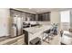 Modern kitchen with stainless steel appliances, granite countertops, and stylish cabinets at 8833 Meade St, Westminster, CO 80031