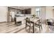 Well-lit kitchen with stainless steel appliances, granite countertops, and island seating at 8833 Meade St, Westminster, CO 80031