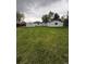 Spacious backyard with a large lawn and a view of the house at 165 Garland St, Lakewood, CO 80226