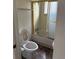 Compact bathroom featuring a shower and vinyl flooring at 165 Garland St, Lakewood, CO 80226