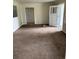 Spacious living room with neutral colored carpet and natural light at 165 Garland St, Lakewood, CO 80226