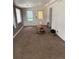 Living room featuring neutral colored carpet and natural light at 165 Garland St, Lakewood, CO 80226