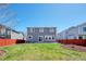 Backyard with a well-maintained lawn, and a privacy fence surrounding the property at 5237 S Malaya Way, Centennial, CO 80015