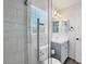 Modern bathroom featuring a glass shower, sleek fixtures, and a light gray vanity at 5237 S Malaya Way, Centennial, CO 80015