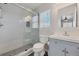 Bright bathroom featuring stylish gray vanity, modern fixtures, and shower at 5237 S Malaya Way, Centennial, CO 80015