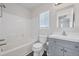 Bright bathroom with a tiled shower, modern vanity, and toilet at 5237 S Malaya Way, Centennial, CO 80015