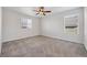 Spacious carpeted bedroom with modern ceiling fan and a window at 5237 S Malaya Way, Centennial, CO 80015