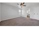 Empty bedroom with carpet, ceiling fan, a window, and neutral wall color at 5237 S Malaya Way, Centennial, CO 80015