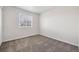 Empty bedroom with carpet, neutral wall color, and a window at 5237 S Malaya Way, Centennial, CO 80015