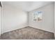 Empty bedroom with carpet, neutral wall color, and a window at 5237 S Malaya Way, Centennial, CO 80015
