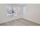 Bright and airy bedroom with large window and wood-look flooring at 9639 Browns Peak Cir, Littleton, CO 80125