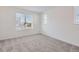 Comfortable bedroom with grey carpet and multiple windows at 9639 Browns Peak Cir, Littleton, CO 80125