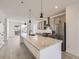Modern kitchen with island, granite countertops, and stainless steel appliances at 9639 Browns Peak Cir, Littleton, CO 80125