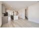 Spacious kitchen features hardwood floors and an open floor plan at 9639 Browns Peak Cir, Littleton, CO 80125