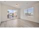 Bright and airy living room with sliding glass doors leading to a balcony at 9639 Browns Peak Cir, Littleton, CO 80125