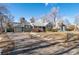 A single story home with driveway and carport at 1351 Reed St, Lakewood, CO 80214