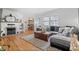 Bright and spacious living room featuring hardwood floors and cozy furniture at 1351 Reed St, Lakewood, CO 80214