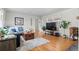 Bright and spacious living room featuring hardwood floors and cozy furniture at 1351 Reed St, Lakewood, CO 80214