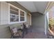 Inviting front porch featuring cozy seating and stylish decor at 1351 Reed St, Lakewood, CO 80214