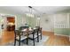 Dining room with hardwood floors, neutral green walls and modern decor at 3190 Ward Ct, Wheat Ridge, CO 80215