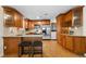 Lovely kitchen with bar seating, stainless appliances, and beautiful cabinets at 3190 Ward Ct, Wheat Ridge, CO 80215