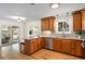Renovated kitchen with granite countertops, stainless steel appliances, and hardwood floors at 3190 Ward Ct, Wheat Ridge, CO 80215