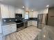 Updated kitchen featuring stainless steel appliances and granite countertops at 12289 W Dakota Dr, Lakewood, CO 80228