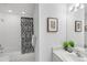 Bright bathroom featuring a vanity with sink and a shower/tub combo at 6102 E Yale Ave, Denver, CO 80222