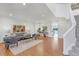 Bright living room features hardwood floors, a neutral color scheme, and an open layout for entertaining at 6102 E Yale Ave, Denver, CO 80222