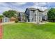 Spacious backyard features lush grass, patio area, and a storage shed in a fenced yard at 8915 Edgewood Ln, Highlands Ranch, CO 80130