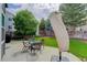 Backyard patio with an umbrella, a green lawn, and a wood fence at 8915 Edgewood Ln, Highlands Ranch, CO 80130