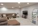 Spacious finished basement with a comfortable seating area, perfect for entertainment and relaxation at 8915 Edgewood Ln, Highlands Ranch, CO 80130