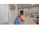 Finished basement playroom with a television, playhouse, and colorful slide at 8915 Edgewood Ln, Highlands Ranch, CO 80130