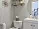 Charming powder room featuring modern fixtures, stylish decor, and convenient placement at 8915 Edgewood Ln, Highlands Ranch, CO 80130