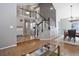 Inviting foyer with hardwood floors, a staircase with white railings, and views into adjacent living spaces at 8915 Edgewood Ln, Highlands Ranch, CO 80130