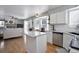 Bright kitchen with granite counters, stainless steel appliances, and connected eat-in dining area at 8915 Edgewood Ln, Highlands Ranch, CO 80130
