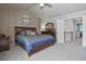 Spacious main bedroom with neutral tones, plush carpeting, and staircase to next level at 8915 Edgewood Ln, Highlands Ranch, CO 80130