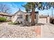 Inviting home with mature trees, showcasing a low-maintenance rock garden and a cozy entryway at 3319 E 27Th Ave, Denver, CO 80205