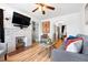 Comfortable living room area with fireplace and an open view of the dining room at 3319 E 27Th Ave, Denver, CO 80205
