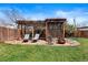 Relaxing outdoor patio with a fire pit and comfortable seating area at 3319 E 27Th Ave, Denver, CO 80205