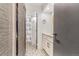 Stylish bathroom featuring patterned flooring, a vanity, and a shower with a blue shower curtain at 789 N Clarkson St # 406, Denver, CO 80218