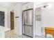 Stainless steel refrigerator and storage in a bright kitchen with decorative floor tiles at 789 N Clarkson St # 406, Denver, CO 80218