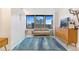 Inviting living room with large windows offering city views and decorative patterned flooring at 789 N Clarkson St # 406, Denver, CO 80218