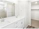 Bathroom featuring double vanity, modern fixtures, and separate glass shower at 571 Homestead Ave, Brighton, CO 80601